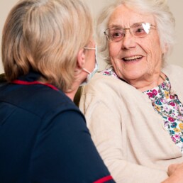 A nurse with a resident at Monson Care Home Lincoln